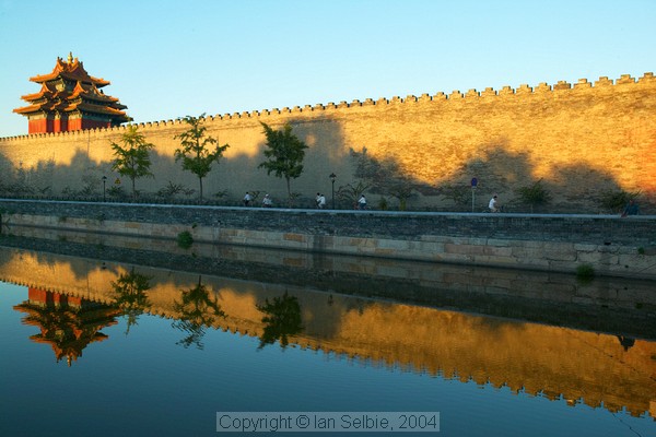 Moat and wall at the east gate of the Forbidden City at sunrise, Beijing