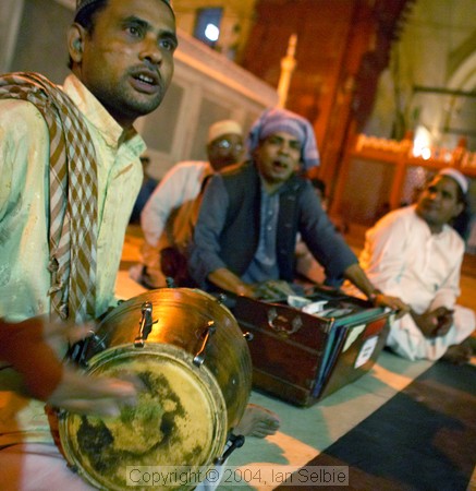 Musicians playing after evening prayers  at the Tomb of Nizammudin, Delhi