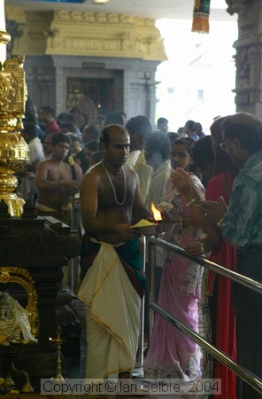 Handing out the flame in celebration of the Depavali Festival at Sri Senpaga Vinayagar Temple, Ceylon Road, Singapore