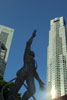 Statue of the Millenium (by Victor Tan) struggling to reach above the UOB buildings