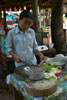Careful with that chopper - making breakfast at a stall near the Bayon