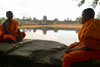 Monks by the moat at Angkor Wat