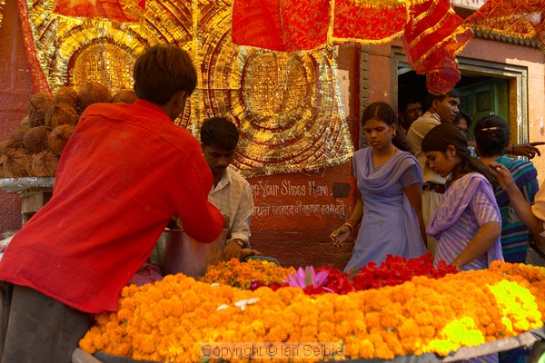 Selling garlands outside the temple, Varanasi
