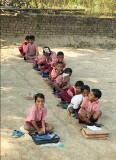 In the countryside near Varanasi: a local school.    The fee for each pupil is 20 rupees per month and each of the 8 teachers is paid 600 rupees per month
