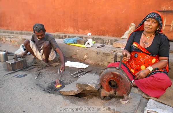 Roadside blacksmith and his wife, old city, Jaipur