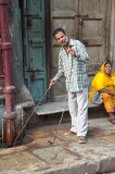 Demonstrating how to clean out the drain