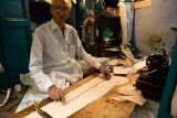 Old man working in his tiny taylor's shop, Old Delhi