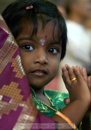 Child praying on the birthday of Lord Ganesha at Sri Senpaga Vinayagar Temple, Ceylon Road, Singapore