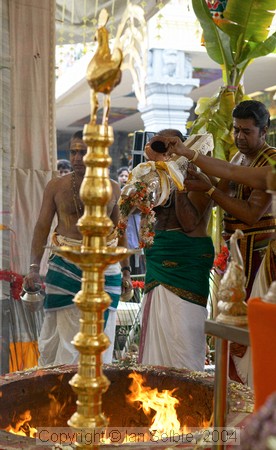 Preparing to douse the flames on the birthday of Lord Ganesha at Sri Senpaga Vinayagar Temple, Ceylon Road, Singapore