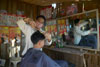 Local barber at work cutting hair