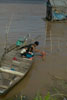 Washing on a boat  in a Vietnamese fishing village on the Mekong River