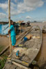 Girl on a boat  in a Vietnamese fishing village on the Mekong River