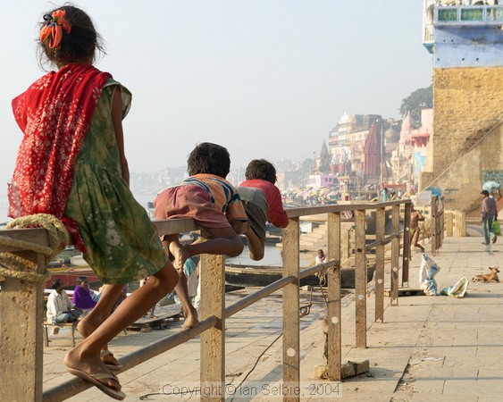 Children playing on the fence, Mir Ghat, Varanasi