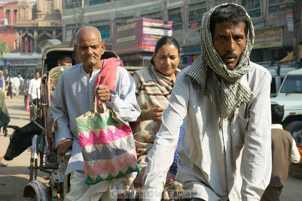 The streets are crowded with pedestrians, pedicabs and motorised vehicles, Varanasi