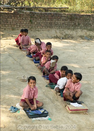 In the countryside near Varanasi: a local school.    The fee for each pupil is 20 rupees per month and each of the 8 teachers is paid 600 rupees per month