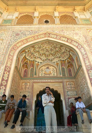 Man and his family under archway, Amber Palace, Jaipur