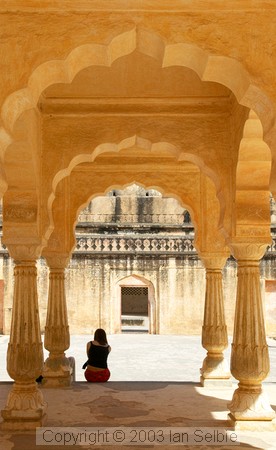 Woman sitting in the inner meeting place, Amber Palace, Jaipur